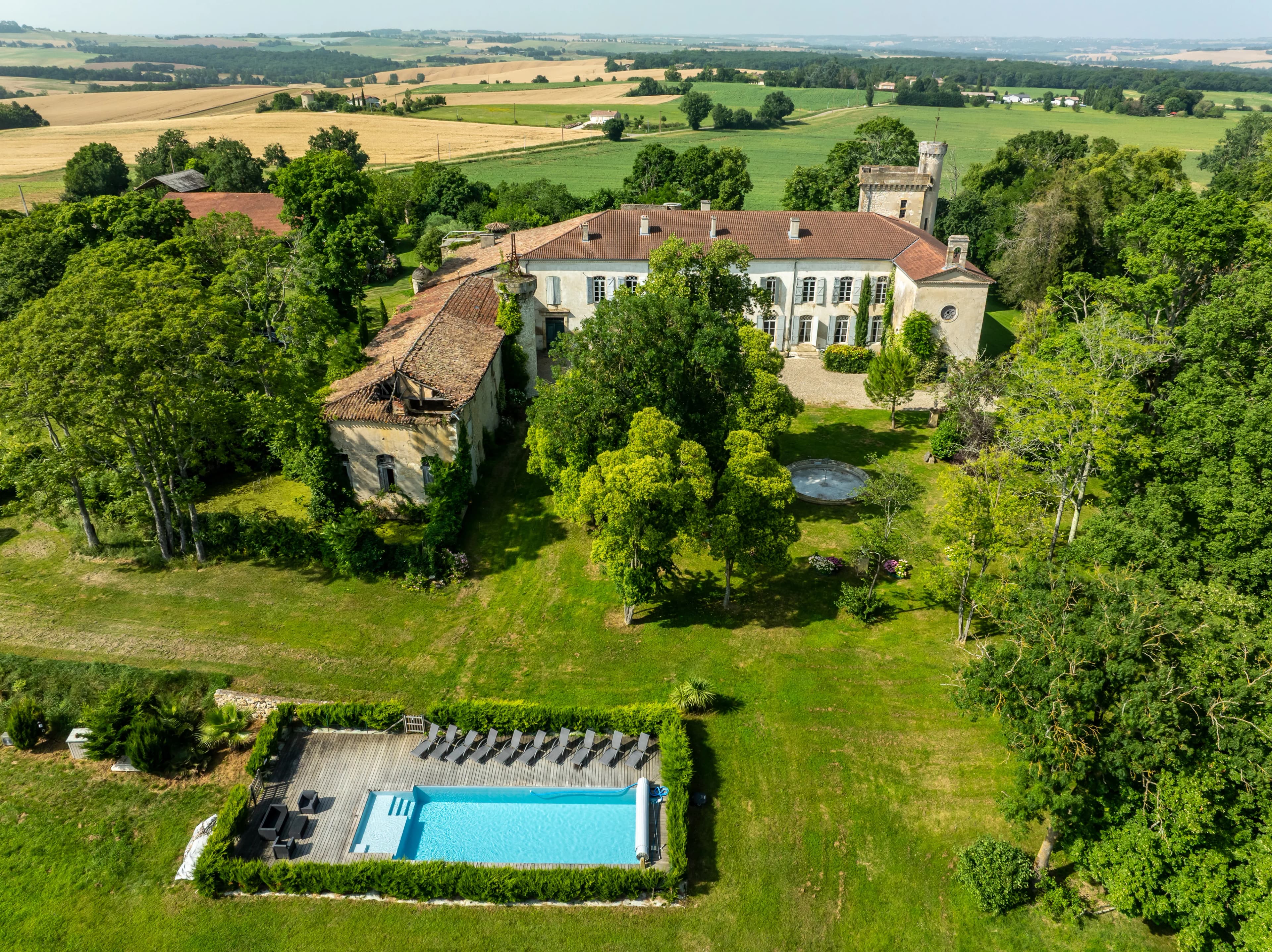 Aerial view of a castle retreat venue surrounded by nature